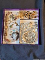 Overall view of jewellery lot inside box
