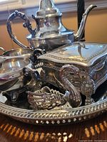 Full lot overview showing tea set, jewelry box, swan dish on tray