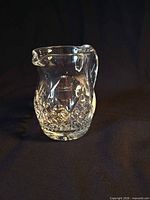 Full view of clear cut crystal cream pitcher front