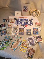 Overview of towel, pitcher, coasters, cards, schedules, stamp booklet