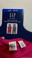 Packaging card showing GAP Kids 2-pack tops size L/G 10/12
