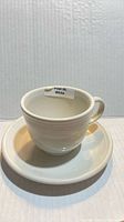 Cup on saucer, label indicating Post 86 White visible