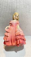 Front view of Royal Doulton Rose figurine showing dress and face