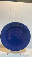 Front view of cobalt blue Fiesta dessert dish on stand