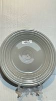 Front of pearl gray Fiesta luncheon plate on stand