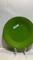 Front view of shamrock green buffet plate on stand