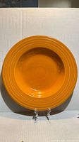 Top view of tangerine Fiesta pasta bowl showing color and rim rings