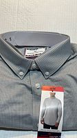Folded grey micro-pattern Modern Ambition dress shirt with size M tag visible