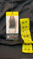 Front view of black Spyder tank top with size S/P hang tag