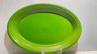 Top view of green Fiesta oval platter showing color and concentric ring design