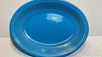 Top view of turquoise Fiesta oval platter showing concentric ring design