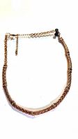Full view of goldtone rhinestone necklace with extender chain