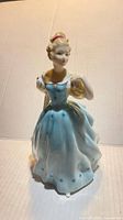 Front view of Royal Doulton Enchantment figurine showing full gown and posture