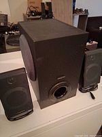 Front view of subwoofer with both satellite speakers