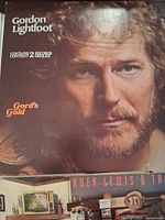 Close-up of Gordon Lightfoot “Gord’s Gold” cover above part of Huey Lewis album