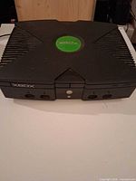 Front and top view of Original Xbox console showing overall condition, disc tray and controller ports