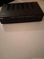 Front angled view of the Pyle PS56 speaker selector showing brand marking, model number and six selector buttons