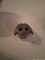 Squat owl figurine top view