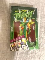 Front view of sealed Plasm trading card box showing artwork, logos and shrinkwrap