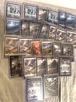 Spread of full-art basic lands in sleeves showing multiple Island, Plains, Mountain, Swamp, Forest cards