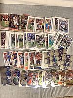 Wide view of all trading cards fanned out on surface