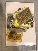 Stack of mixed vintage and reproduction bottle labels