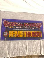 Front view of Bonus Frenzy Quick Hit Pay backglass showing full artwork and payout information
