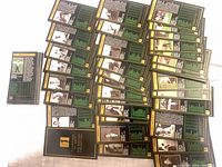 Spread of roughly fifty black-back Masters Collection cards, reverse sides visible