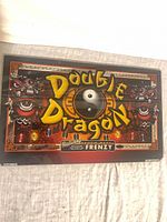 Front view of Double Dragon glass panel showing full artwork