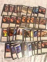 Spread of roughly 100 Flesh and Blood cards laid out