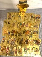 Spread of gold foil Pokémon cards and box