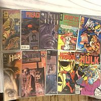 All ten bagged comics laid out