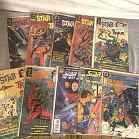 All ten bagged Star Trek comics laid out in two rows