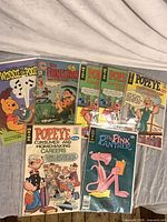 All seven comics bagged and laid out