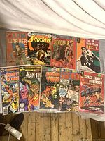 All nine bagged comics laid out on floor