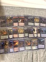 All cards laid out in sleeves and toploaders showing extended art format