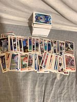 overview showing spread of assorted baseball cards and stacked pile