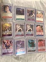 Front view of 15 sleeved holo cards arranged in rows