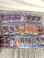 Front view of multiple sleeved One Piece character cards spread out