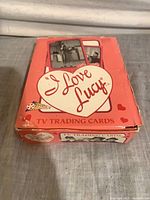 Closed box top view showing I Love Lucy heart logo and Pacific branding