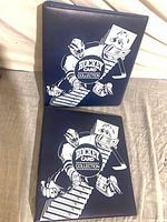 Front view of both binders showing graphics