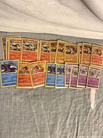 Front view showing assortments of Reshiram, Ho-Oh, Kyogre, Groudon, Cosmoem cards