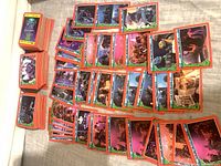 Loose spread of orange-border TMNT II trading cards