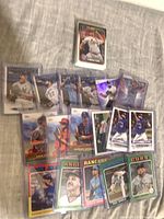 Group of sleeved Topps baseball cards spread out