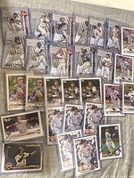 Overview of all 30 sleeved Topps cards laid out showing mix of base and Platinum Players inserts