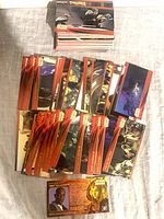 Overhead view of stacked and laid-out Star Wars Episode I trading cards showing fronts
