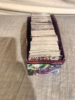 Box filled with large stack of hockey trading cards