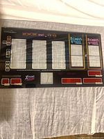 Full view of WMS X-Treme 100X Wins backglass showing all reel windows and graphics