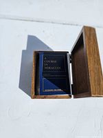 Open wooden box showing the blue A Course in Miracles lesson card deck