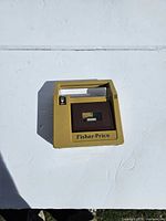 Front view showing cassette door and logo